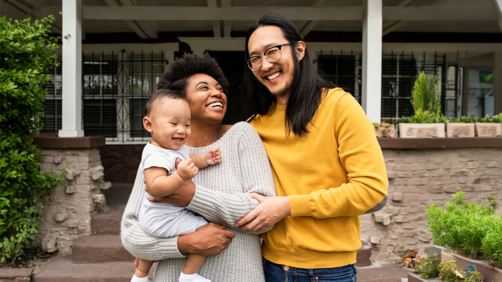 Family in front of house