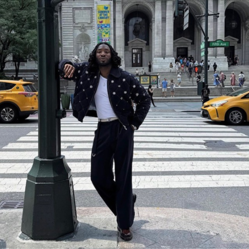 Odeal standing on New York street corner